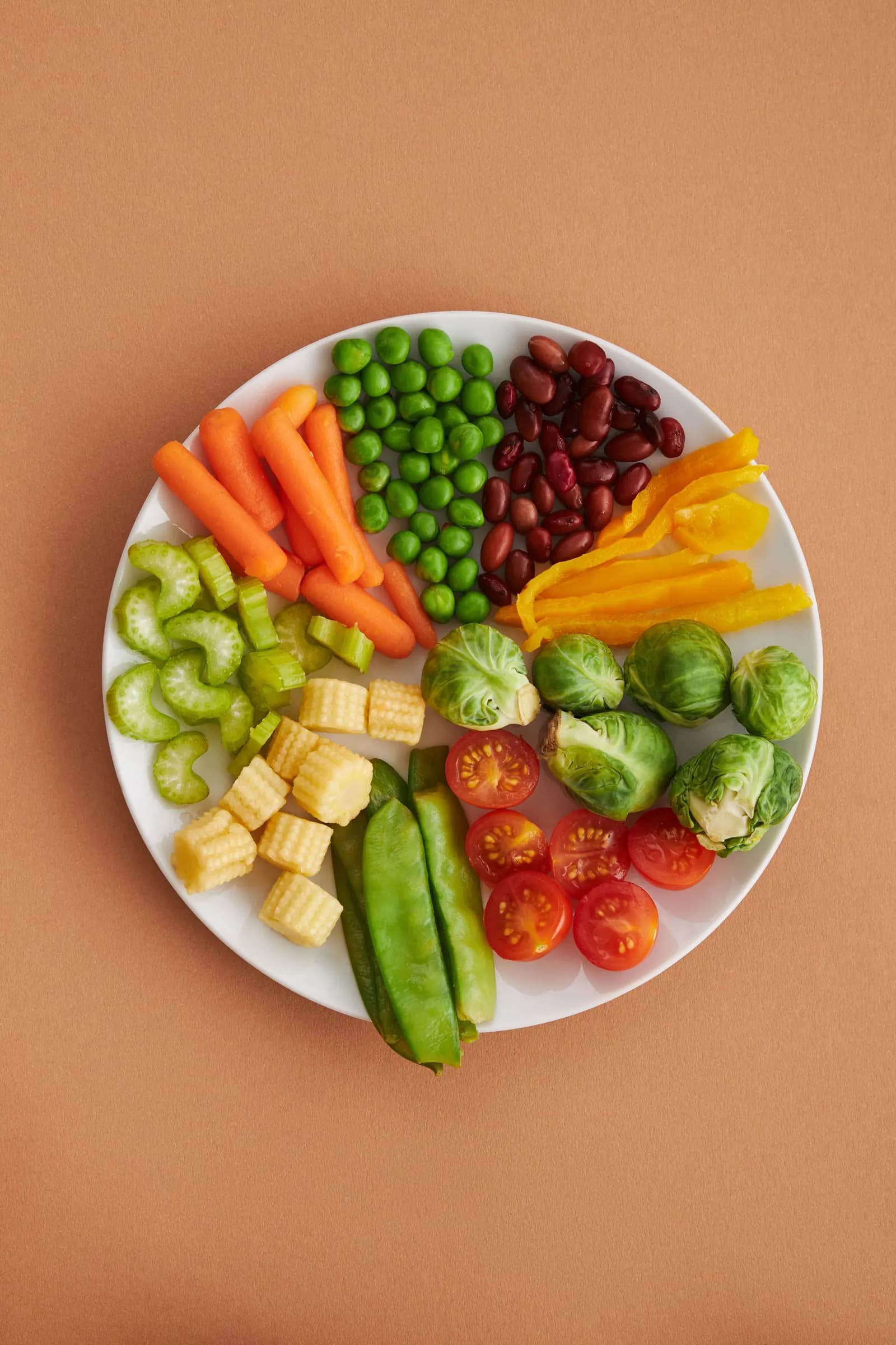 An assortment of fresh vegetables arranged on a plate.